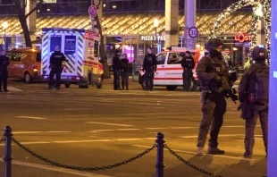 Police and ambulances stand next to a Christmas market where a car crashed into a crowd injuring between 60 and 80 people, according to a spokesman for the local rescue service, on Dec. 20, 2024, in Magdeburg, eastern Germany. Credit: NEWS5/NEWS5/AFP via Getty Images