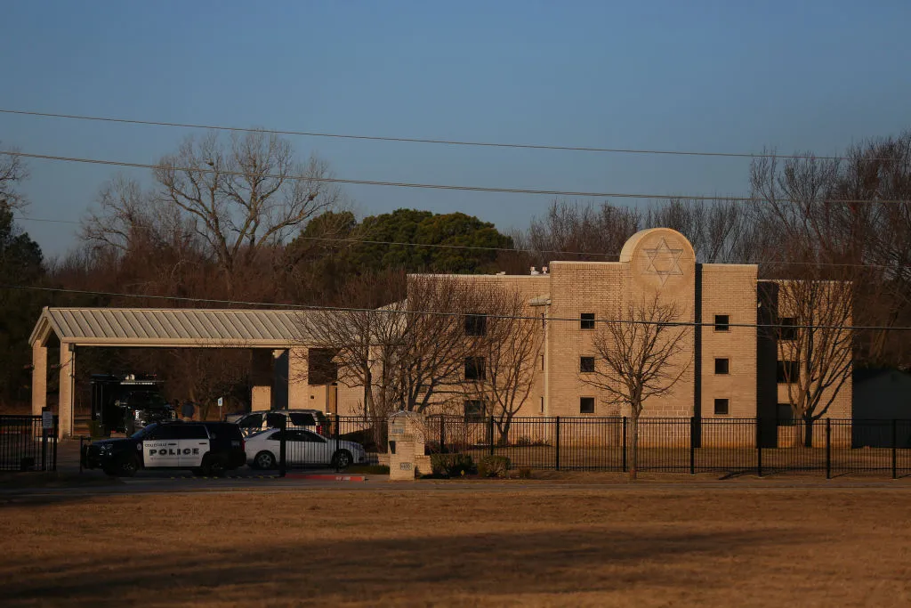 A police car sits in front of the Congregation Beth Israel Synagogue in Colleyville, Texas, some 25 miles west of Dallas, Jan. 16, 2022. - All four people taken hostage in a more than 10-hour standoff at the Texas synagogue have been freed unharmed, police said late Jan. 15, and their suspected captor is dead.?w=200&h=150