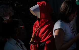 Pamela Smith dressed as characters of "The Handmaids Tale" walks with a noose around her neck as she joins pro-choice protesters gather in large numbers in front of the federal building to defend abortion rights in San Francisco on May 3, 2022. Nick Otto/AFP via Getty Images