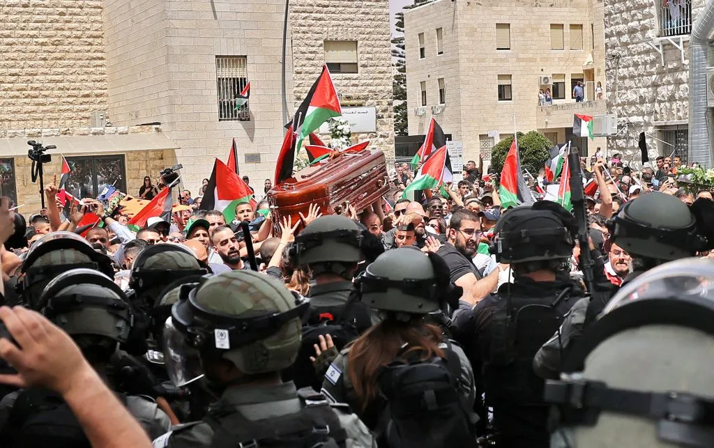 Violence erupts between Israeli security forces and Palestinian mourners carrying the coffin of slain Al-Jazeera journalist Shireen Abu Akleh out of a hospital, before being transported to a church and then her resting place, in Jerusalem, on May 13, 2022.?w=200&h=150