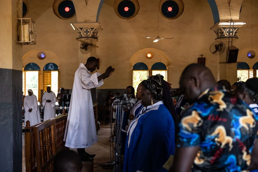 Worshippers attend a mass at Ouagadougou's Catholic cathedral on June 12, 2022, in Burkina Faso. The country has been grappling with Islamist terrorism since 2015 and Christian communities live in fear of furhter attacks.?w=200&h=150