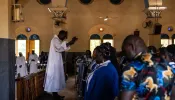 Worshippers attend a Mass at Ouagadougou's Catholic cathedral on June 12, 2022, in Burkina Faso. The country has been grappling with Islamist terrorism since 2015 and Christian communities live in fear of furhter attacks.