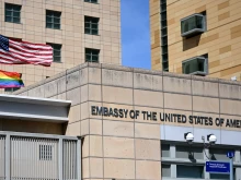 U.S. national and rainbow flags are pictured on the U.S. embassy in Moscow on June 30, 2022.