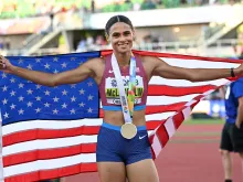 Sydney Mclaughlin-Levrone poses with her medal after winning the women’s 400-meter hurdles final and setting a new world record during the World Athletics Championships at Hayward Field in Eugene, Oregon, on July 22, 2022.