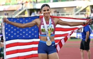 Sydney Mclaughlin-Levrone poses with her medal after winning the women’s 400-meter hurdles final and setting a new world record during the World Athletics Championships at Hayward Field in Eugene, Oregon, on July 22, 2022. Credit: JEWEL SAMAD/AFP via Getty Images