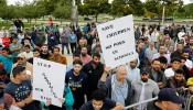 Demonstrators who support keeping inappropriate books out of libraries gather during a protest outside of the Henry Ford Centennial Library in Dearborn, Michigan, on Sept. 25, 2022.