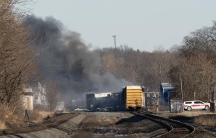 Smoke rises from a derailed cargo train in East Palestine, Ohio, on Feb. 4, 2023. Photo by DUSTIN FRANZ/AFP via Getty Images