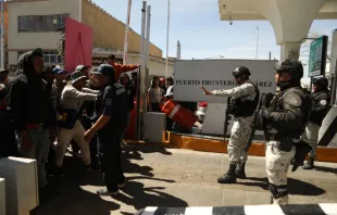 Migrants, mostly of Venezuelan origin, attempt to forcibly cross into the United States at the Paso del Norte International Bridge in Ciudad Juarez, Chihuahua state, Mexico, on March 12, 2023. Photo by HERIKA MARTINEZ/AFP via Getty Images