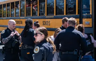 School buses with children arrive at Woodmont Baptist Church to be reunited with their families after a mass shooting at The Covenant School on March 27, 2023, in Nashville, Tennessee. According to initial reports, three students and three adults were killed by the shooter, a 28-year-old woman. The shooter was killed by police responding to the scene. Credit: Seth Herald/Getty Images