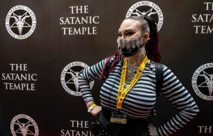 Mischief Madness, a staff member at the convention, wears a custom-decorated mask with a pentagram on it at Satan Con in Boston, Massachusetts, on April 28, 2023. Credit: JOSEPH PREZIOSO/AFP via Getty Images