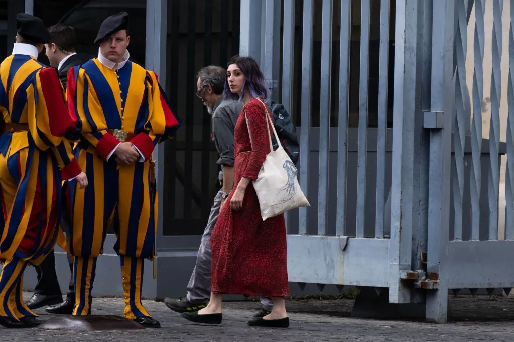 Ultima Generazione (Last Generation) climate change activists Ester Goffi (right) and Guido Viero (second right) arrive at the Vatican on May 24, 2023, to attend their second hearing for having glued themselves to the statue of "Laocoon and His Sons" at the Vatican Museums in August 2022.?w=200&h=150