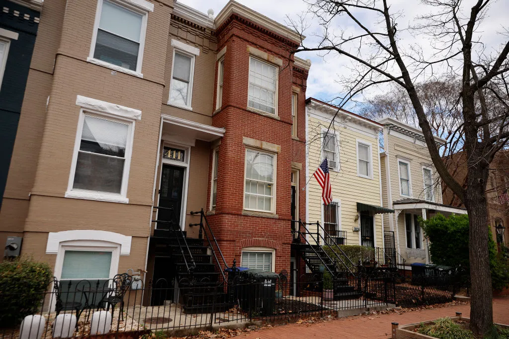 A red-brick row house (C) is seen where DC Metro Police said they found five fetuses inside where anti-abortion activists were living earlier this week in the Capitol Hill neighborhood on April 01, 2022 in Washington, DC. Nine people, some of whom lived or stayed in the house, were indicted Wednesday on federal civil rights counts, with prosecutors alleging that they violated the Freedom of Access to Clinic Entrances Act when they blockaded an abortion clinic with chain and rope in 2020. Authorities do not know how the fetuses were obtained or how they got into the home where anti-abortion activist Lauren Handy was staying before she was arrested.?w=200&h=150