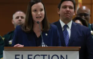 Florida Gov. Ron DeSantis listens as Florida Attorney General Ashley Moody speaks during a press conference at the Broward County Courthouse on Aug. 18, 2022, in Fort Lauderdale, Florida. Credit: Joe Raedle/Getty Images