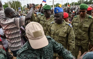 Niger's National Council for the Safeguard of the Homeland  Colonel-Major Amadou Abdramane (center), General Mohamed Toumba (center-left), and Colonel Ousmane Abarchi (right) are greeted upon their arrival at the Stade General Seyni Kountche in Niamey, Niger, on Aug. 6, 2023. Credit: AFP via Getty Images