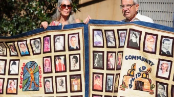 Abuse victims and their supporters hold quilts bearing portraits of abused children while gathered outside the Cathedral of Our Lady of the Angels in Los Angeles on Feb. 1, 2013, one day after the release of personnel files of priests accused of sexual misconduct.