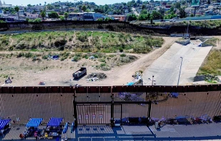 This aerial picture taken on Sept. 14, 2023, shows the U.S.-Mexico border fence with camp shelters left by migrants in San Ysidro, California. Credit: SANDY HUFFAKER/AFP via Getty Images