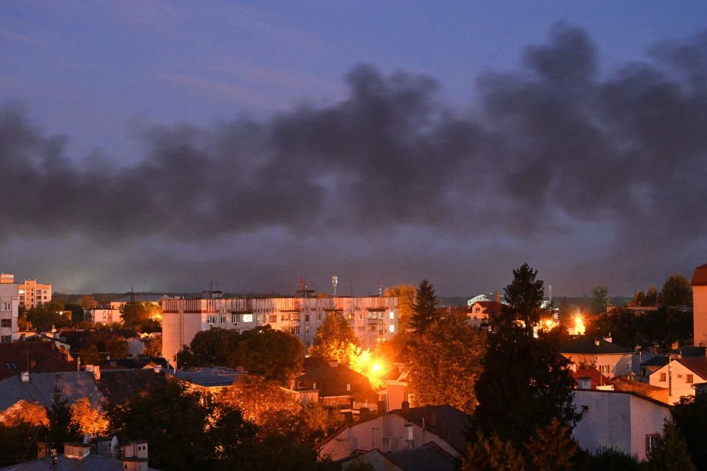 Black smoke billows over the city after drone strikes in the western Ukrainian city of Lviv on Sept. 19, 2023, amid Russia's military invasion on Ukraine. Drones attacked Ukraine's western city of Lviv early on Sept. 19, and explosions rang out, causing a warehouse fire and wounding at least one person.?w=200&h=150