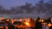 Black smoke billows over the city after drone strikes in the western Ukrainian city of Lviv on Sept. 19, 2023, amid Russia's military invasion on Ukraine. Drones attacked Ukraine's western city of Lviv early on Sept. 19, and explosions rang out, causing a warehouse fire and wounding at least one person.