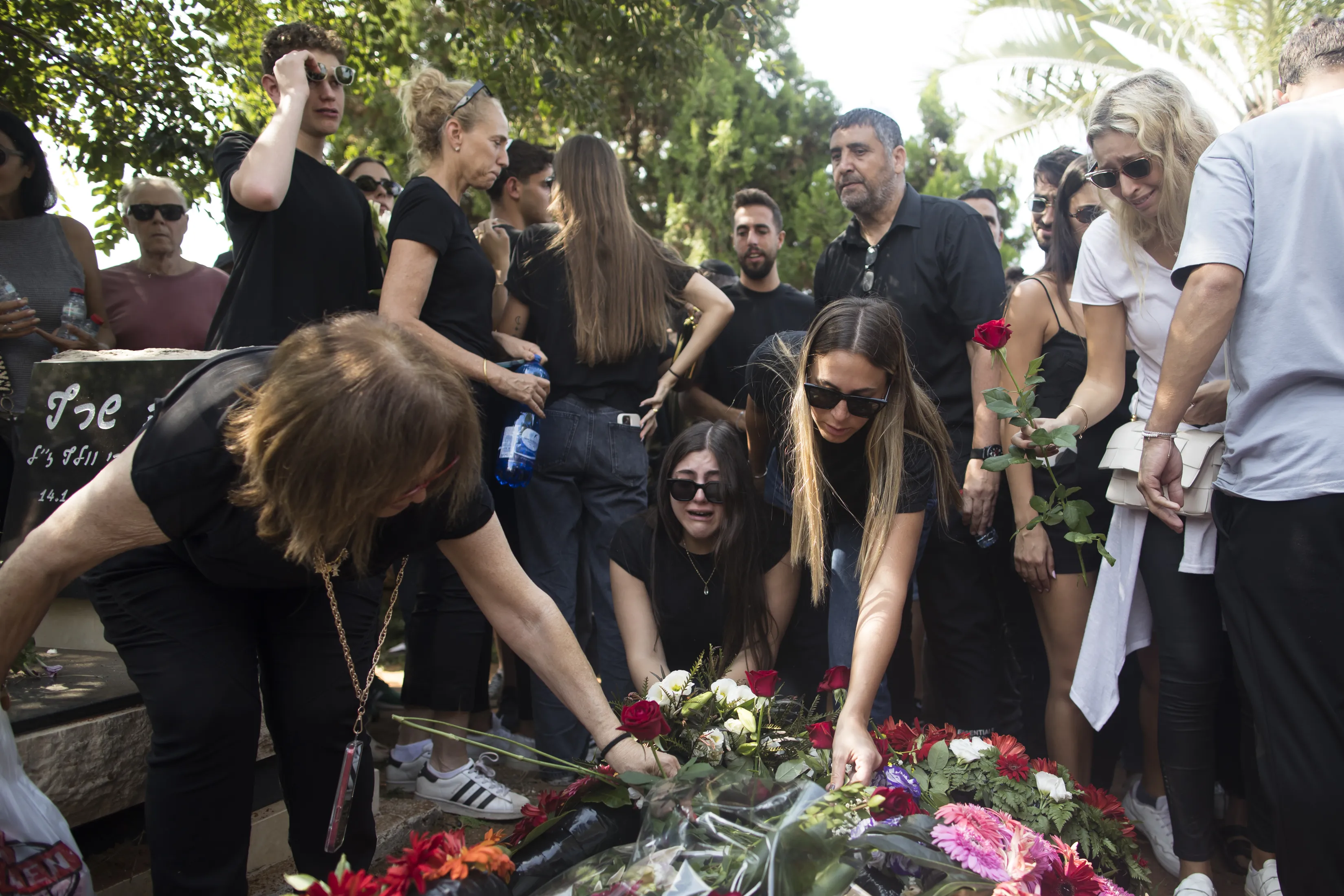 Family and friends of May Naim, 24, who was murdered by Palestinians militants at the "Supernova" festival near the Israeli border with Gaza Strip, react during her funeral on Oct. 11, 2023, in Gan Haim, Israel.?w=200&h=150