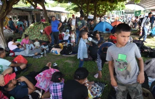 Migrants take a rest while taking part in a caravan toward the border with the United States in Tapachula, Chiapas State, Mexico, on Oct. 31, 2023. Credit: ISAAC GUZMAN/AFP via Getty Images