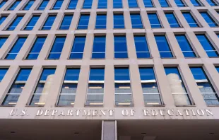 The U.S. Department of Education sign hangs over the entrance to the federal building housing the agency's headquarters on Feb. 9, 2024, in Washington, D.C. Credit: J. David Ake/Getty Images