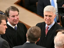 U.S. Supreme Court Associate Justices Brett Kavanaugh (left) and Neil Gorsuch (right) arrive for President Joe Biden’s State of the Union address in the House Chamber of the U.S. Capitol in Washington, D.C., on March 7, 2024.