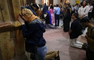 Christian worshippers pray at the Church of the Holy Sepulchre in the Old City of Jerusalem on Easter Sunday, March 31, 2024. Credit: AHMAD GHARABLI/AFP via Getty Images