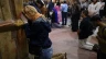 Christian worshippers pray at the Church of the Holy Sepulchre in the Old City of Jerusalem on Easter Sunday, March 31, 2024.