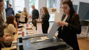 People cast their ballot in a polling station on June 6, 2024, in The Hague, Netherlands. Voters in 27 European Union countries go to the polls over the next four days to elect members of the European Parliament.