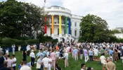 The pillars of the South Portico of the White House are decorated in rainbow colors as guests attend a White House Pride Month celebration on the South Lawn of the White House in Washington, D.C., on June 26, 2024.