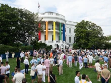 The pillars of the South Portico of the White House are decorated in rainbow colors as guests attend a White House Pride Month celebration on the South Lawn of the White House in Washington, D.C., on June 26, 2024.