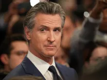 California Gov. Gavin Newsom speaks to reporters in the spin room following the CNN presidential debate between President Joe Biden and former president Donald Trump at the McCamish Pavilion on the Georgia Institute of Technology campus on June 27, 2024, in Atlanta.