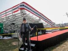 Law enforcement agents stand near the stage of a campaign rally for Republican presidential candidate Donald Trump on July 13, 2024, in Butler, Pennsylvania, after an assassination attempt on the former president.