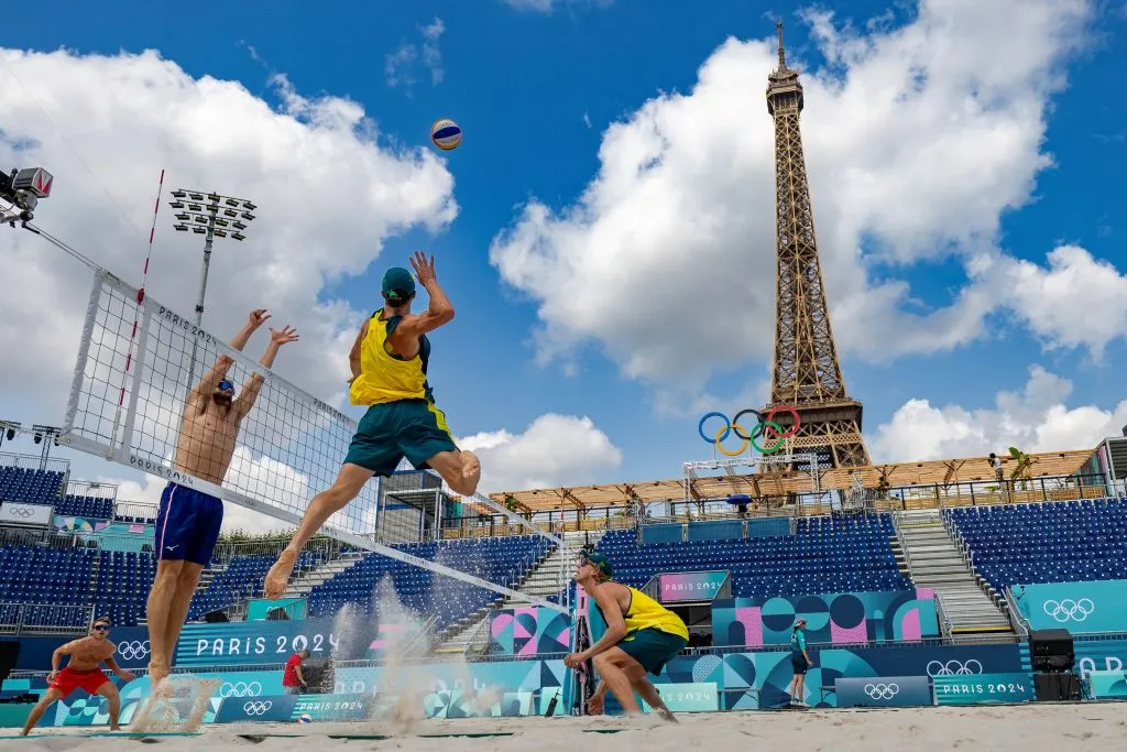 Norwegian players Christian Sorum (left), Anders Mol (second left), and Australian players Zachery Schubert (second right) and Thomas Hodges (right) take part in a practice session ahead of the opening of the Paris 2024 Olympic Games at the Eiffel Tower Stadium in Paris on July 24, 2024.?w=200&h=150