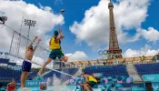Norwegian players Christian Sorum (L), Anders Mol (2ndL) and Australian players Zachery Schubert (2ndR) and Thomas Hodges (R) take part in a practice session ahead of the opening of the Paris 2024 Olympic Games at the Eiffel Tower Stadium in Paris on July 24, 2024.