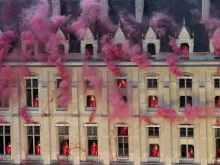 Smoke billows near windows as performers participate in the opening ceremony of the 2024 Olympic Games in Paris on July 26, 2024.