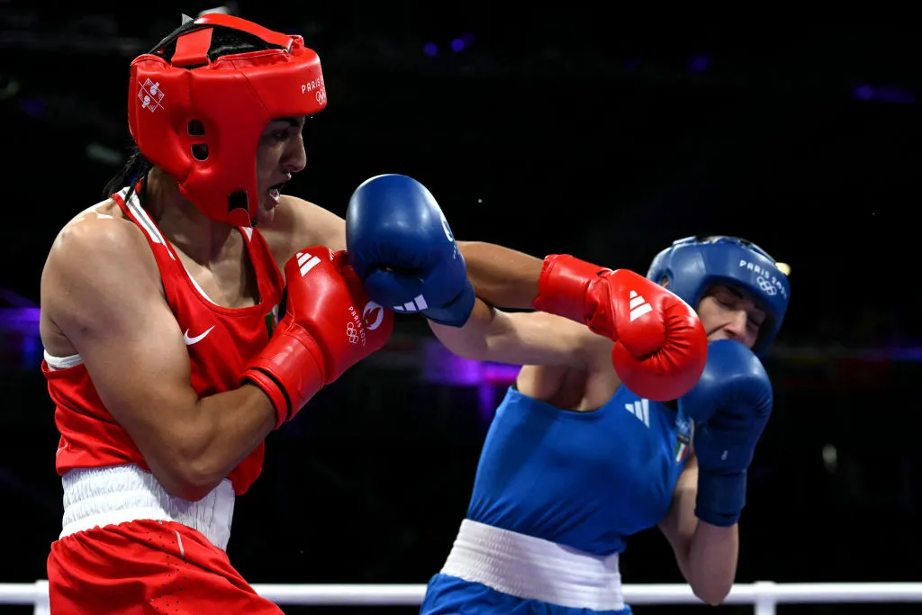 Algeria's Imane Khelif (in red) punches Italy’s Angela Carini in the women’s 66kg preliminaries round of 16 boxing match during the Paris 2024 Olympic Games at the North Paris Arena in Villepinte on Aug. 1, 2024.?w=200&h=150