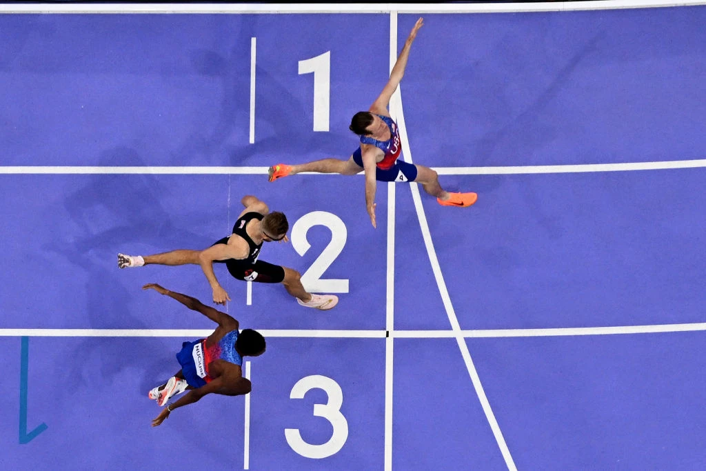 U.S. Olympian Cole Hocker crosses the finish line to win the men’s 1,500-meter final at Stade de France in Saint-Denis, north of Paris, on Aug. 6, 2024.?w=200&h=150