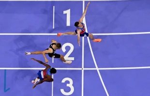 U.S. Olympian Cole Hocker crosses the finish line to win the men’s 1,500-meter final at Stade de France in Saint-Denis, north of Paris, on Aug. 6, 2024. Credit: JEWEL SAMAD/AFP via Getty Images