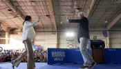 Democratic presidential candidate, U.S. Vice President Kamala Harris and Democratic vice presidential candidate Minnesota Gov. Tim Walz appear on stage together during a campaign event on Aug. 7, 2024, in Detroit.