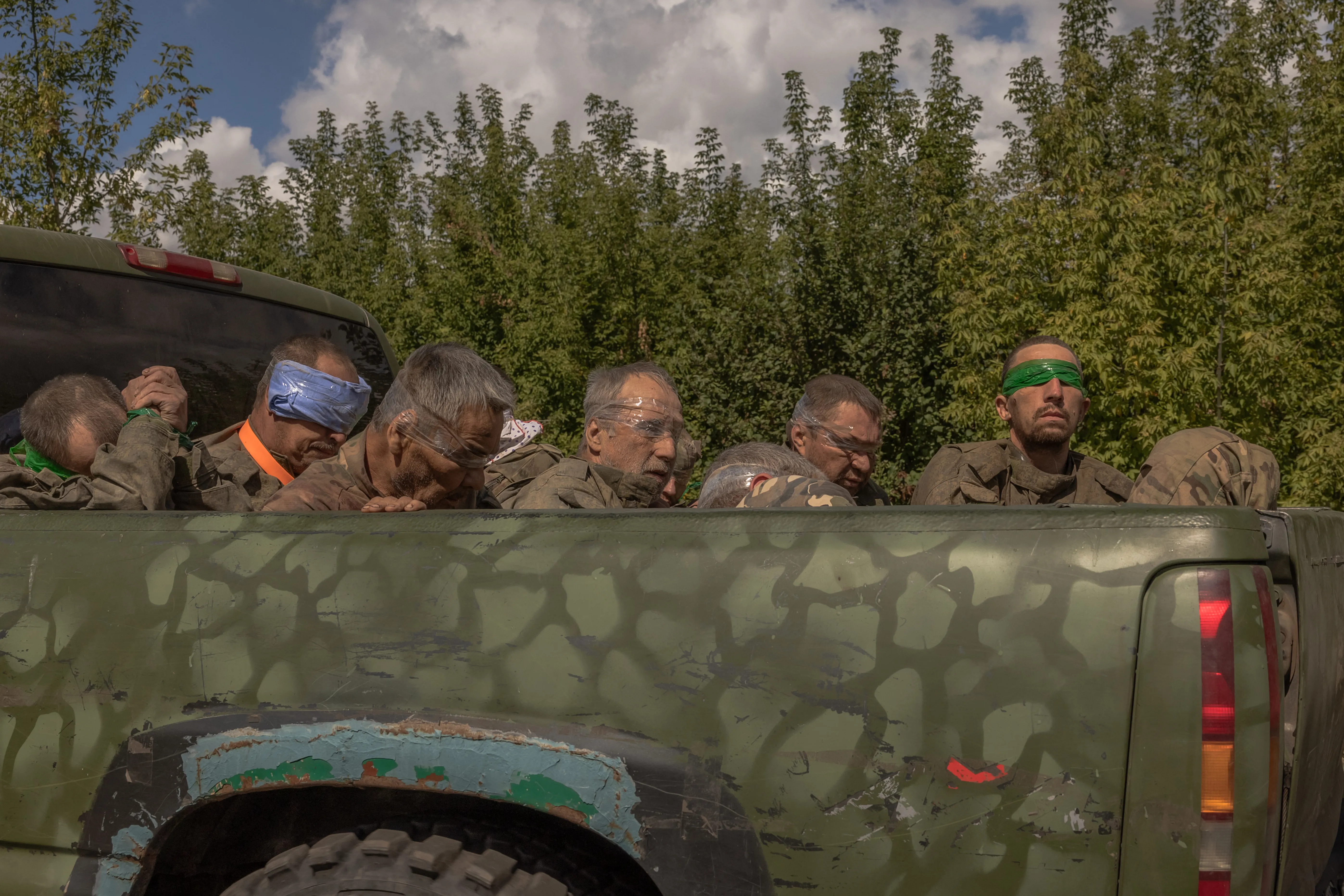 A Ukrainian military vehicle drives from the direction of the border with Russia carrying blindfolded men in Russian military uniforms in the Sumy region on Aug. 13, 2024, amid the Russian invasion of Ukraine.?w=200&h=150