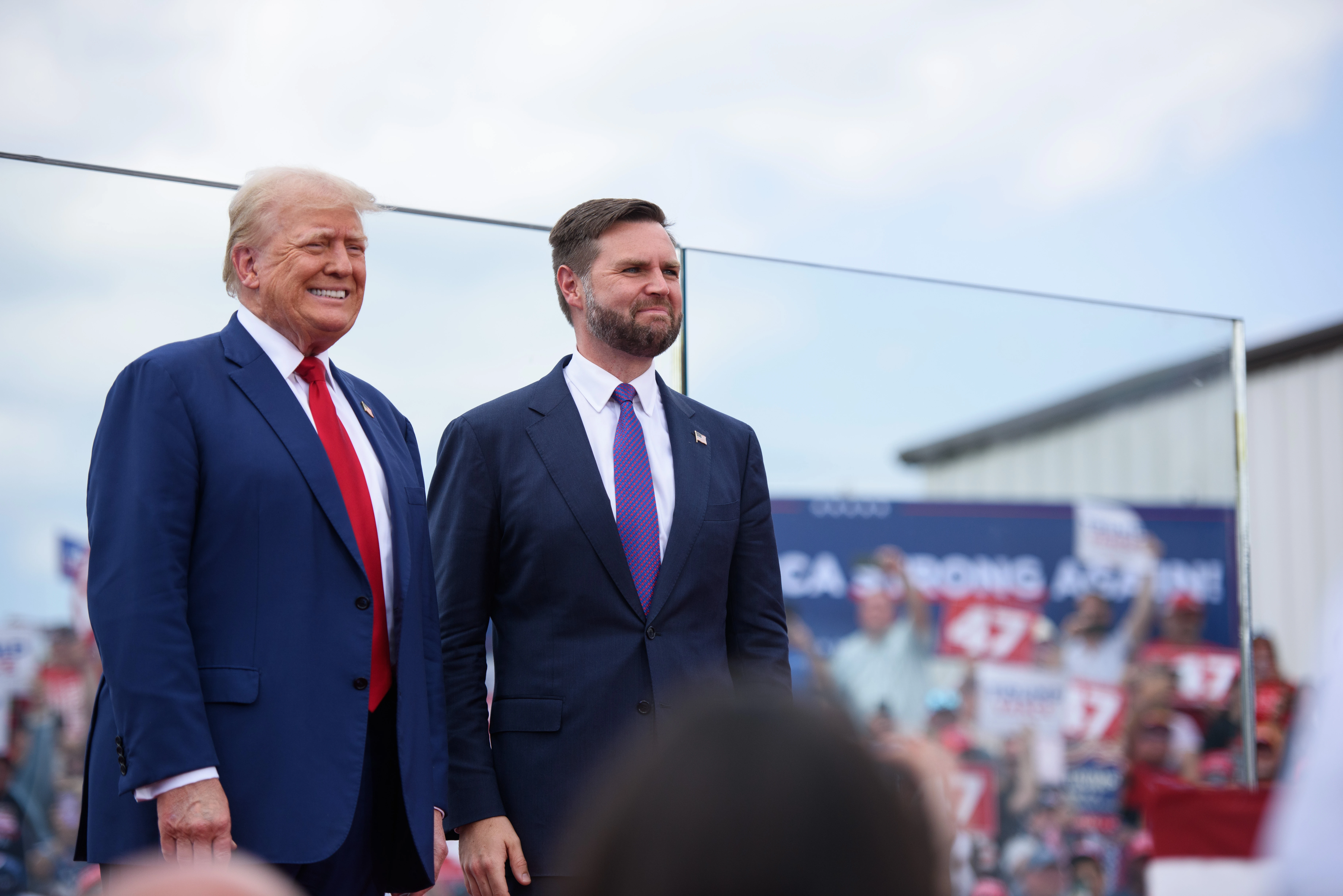 Republican presidential candidate and former U.S. president Donald Trump, left, poses for photos with Republican vice presidential candidate Sen. J.D. Vance of Ohio before making remarks to a crowd during an event on Aug. 21, 2024, in Asheboro, North Carolina.?w=200&h=150