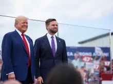 Republican presidential candidate and former U.S. president Donald Trump, left, poses for photos with Republican vice presidential candidate Sen. J.D. Vance of Ohio before making remarks to a crowd during an event on Aug. 21, 2024, in Asheboro, North Carolina.