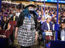 A pro-abortion attendee stands during the first day of the Democratic National Convention at the United Center on Aug. 19, 2024, in Chicago.