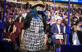 A pro-abortion attendee stands during the first day of the Democratic National Convention at the United Center on Aug. 19, 2024, in Chicago. Credit: Andrew Harnik/Getty Images