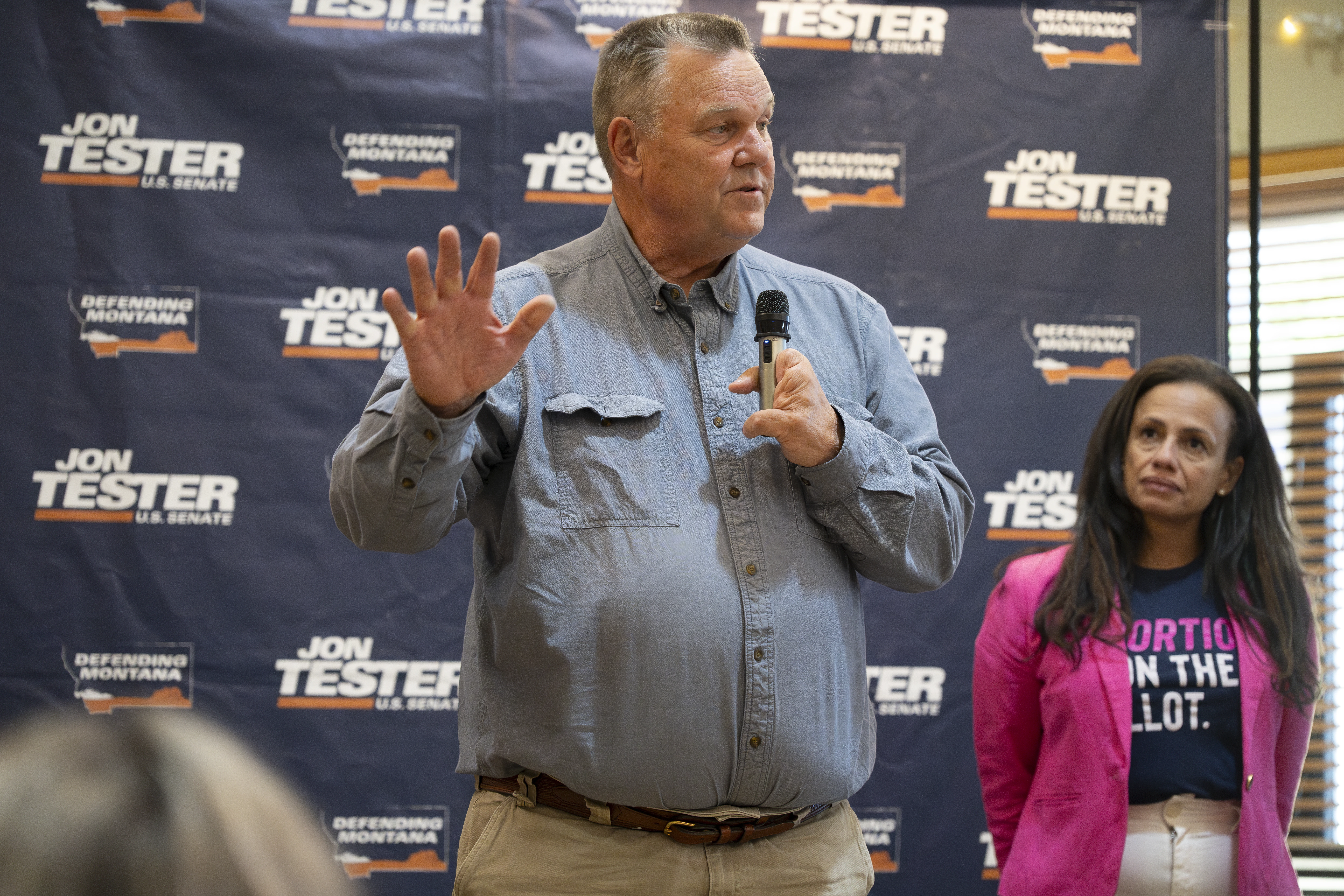 Sen. Jon Tester, D-Montana, speaks as Planned Parenthood Action Fund President and CEO Alexis McGill Johnson (right) looks on during a rally on Sept. 5, 2024, in Bozeman, Montana. The Right to Abortion Initiative will be on the Nov. 5 ballot as an amendment to Montana’s constitution. Tester attended the rally in support of the initiative.?w=200&h=150