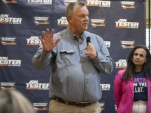 Sen. Jon Tester, D-Montana, speaks as Planned Parenthood Action Fund President and CEO Alexis McGill Johnson (right) looks on during a rally on Sept. 5, 2024, in Bozeman, Montana. The Right to Abortion Initiative will be on the Nov. 5 ballot as an amendment to Montana’s constitution. Tester attended the rally in support of the initiative.