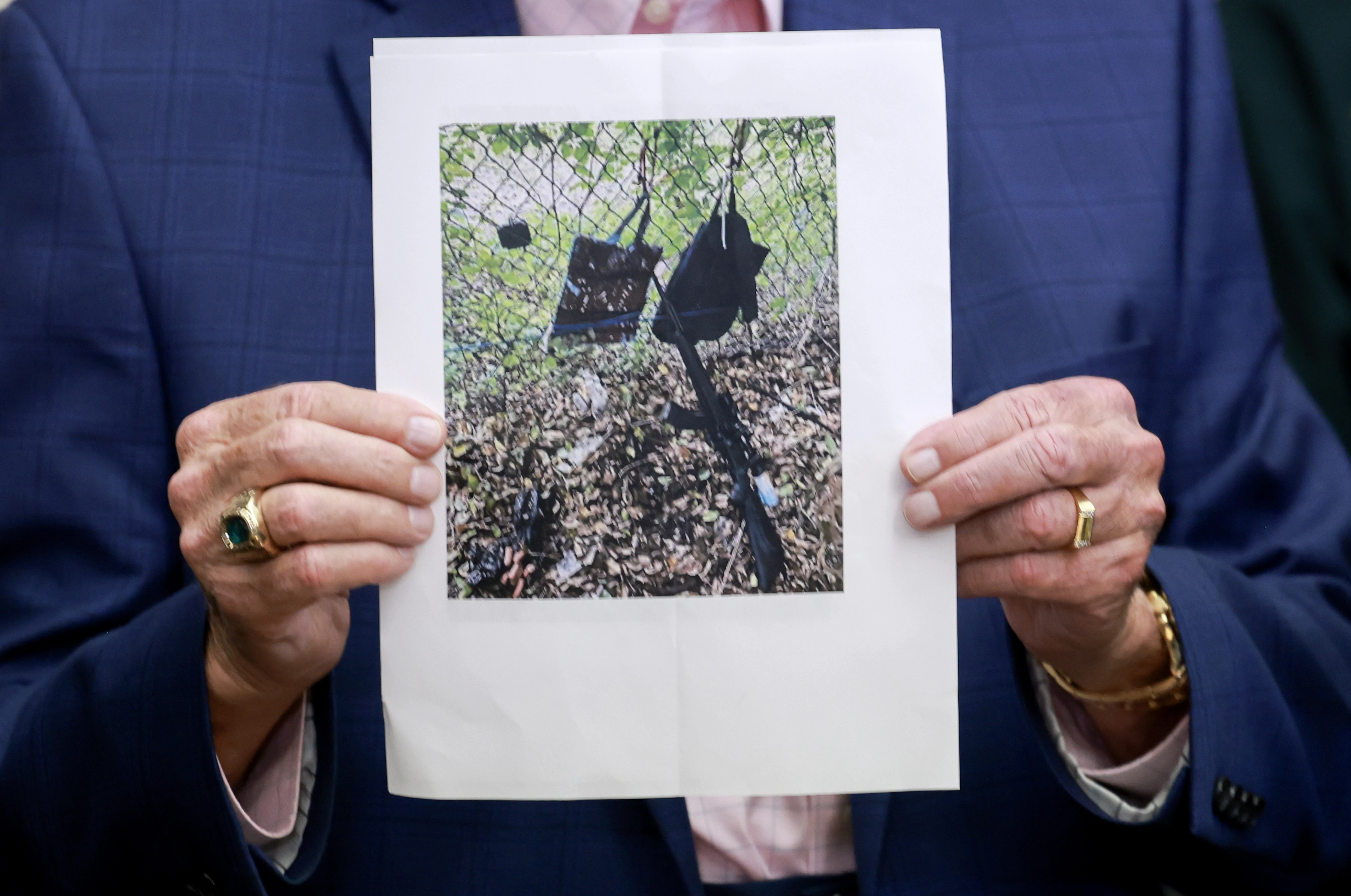 Palm Beach County Sheriff Ric Bradshaw holds a photograph of the rifle and other items found near where a suspect was discovered during a press conference regarding an apparent assassination attempt of former President Donald Trump on Sept. 15, 2024, in West Palm Beach, Florida.?w=200&h=150