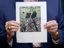 Palm Beach County Sheriff Ric Bradshaw holds a photograph of the rifle and other items found near where a suspect was discovered during a press conference regarding an apparent assassination attempt of former President Donald Trump on Sept. 15, 2024, in West Palm Beach, Florida.