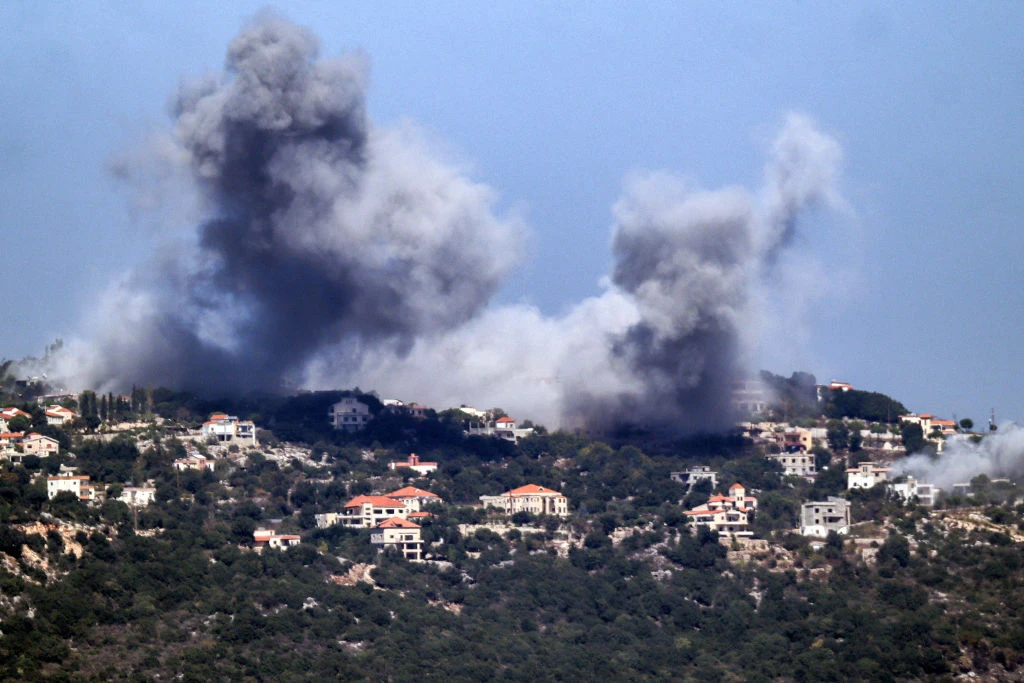 A cloud of smoke erupts during an Israeli air strike on the village of Sujud in southern Lebanon on Sept. 25, 2024. Israel announced dozens of new air strikes on Hezbollah strongholds in Lebanon on Sept. 24, a day after 492 people, including 35 children, were killed in the deadliest bombardment since a devastating war in 2006.?w=200&h=150